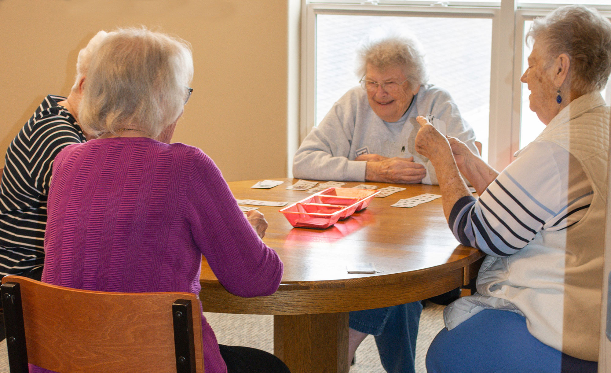 The Estates at Moorhead – residents playing cards